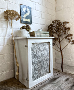 A Vintage French white chippy painted wooden bathroom wall hung cabinet