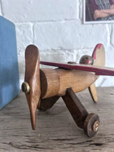 Load image into Gallery viewer, Vintage wooden toy propeller plane with pilot