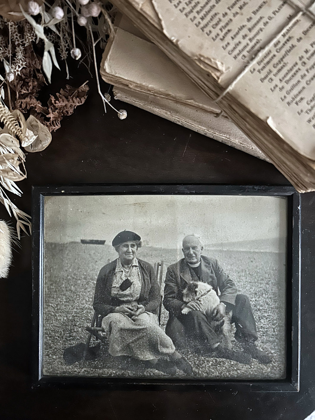 Vintage black and white holiday photograph with vicar & dog