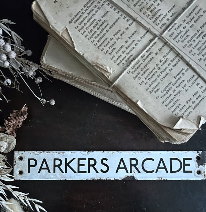 Vintage enamel arcade sign typography