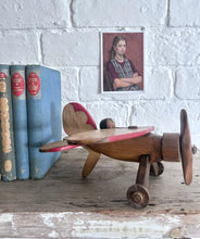 Load image into Gallery viewer, Vintage wooden toy propeller plane with pilot
