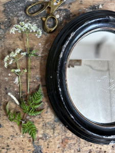 Petit French antique 19th Century oval black mirror