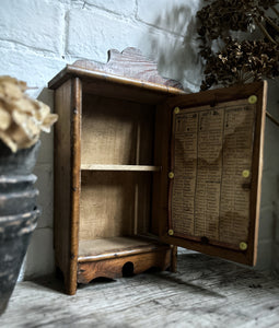 Small French antique wall hung wooden cabinet with shelves foxed glass door mirror