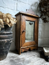 Load image into Gallery viewer, Small French antique wall hung wooden cabinet with shelves foxed glass door mirror