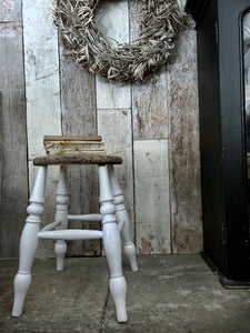 A wooden and white painted vintage country style kitchen stool