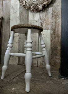 A wooden and white painted vintage country style kitchen stool