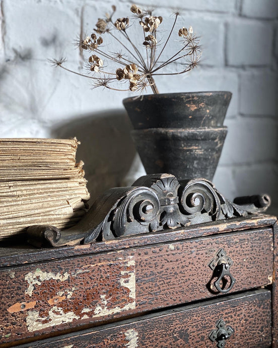 This lovely decorative black French antique pediment makes a beautiful prop for a shelf or mantlepiece.