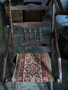 An Antique Victorian wooden frame folding campaign chair with carpet seat