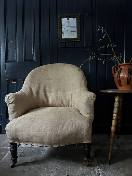 A French Antique Napoleon III slipper back hessian covered arm chair