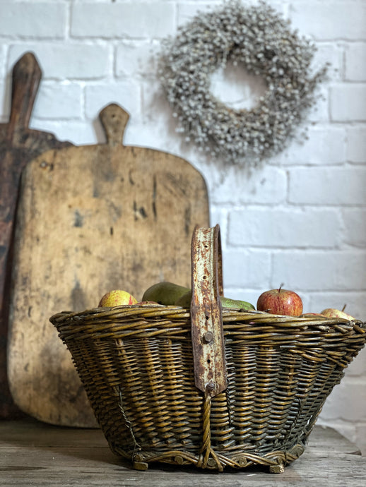 This lovely rustic vintage French basket with a recycled handle made from an old bicycle wheel, was used by grape harvesters on the vineyards, for collecting grapes.