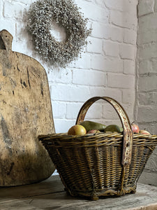 This lovely rustic vintage French basket with a recycled handle made from an old bicycle wheel, was used by grape harvesters on the vineyards, for collecting grapes.
