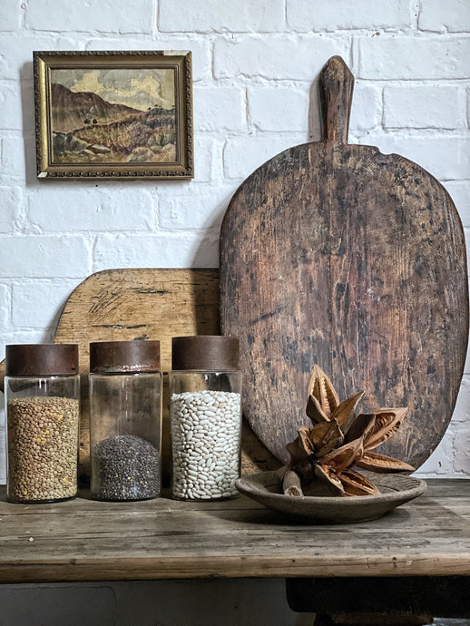 A Rustic Vintage Wooden European Bread Serving Board