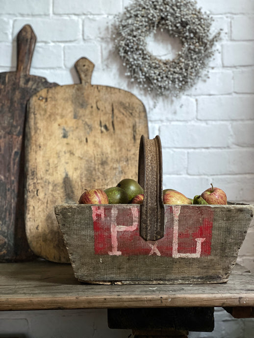 This lovely rustic vintage French wooden trug with a recycled handle made from an old bicycle wheel, which was used by grape harvesters on the vineyards, for collecting grapes.
