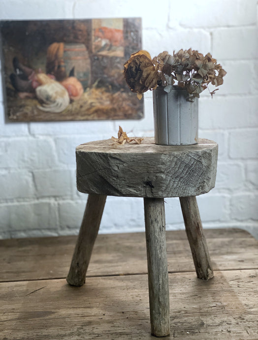 A rustic primitive French hand sawn wooden 3 legged tripod farmhouse milking stool