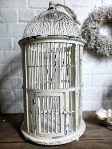 A white Decorative Vintage style bird cage
