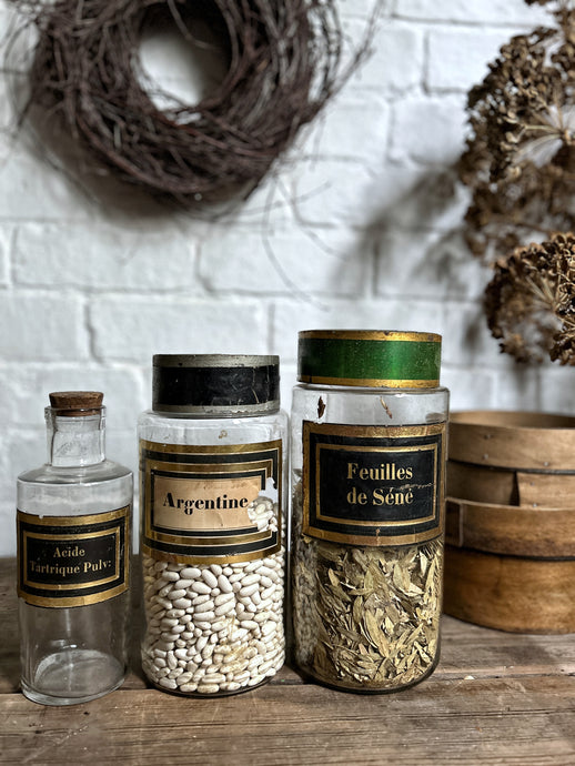 A set of three french antique glass apothecary storage jars