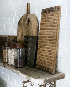 A vintage rustic wooden cigar press with original label on reverse