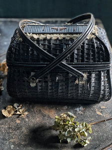 This beautiful Vintage French dark woven wicker & cotton ribbon basket, would have been used to transport birds or eggs back from the market.  It is beautifully made and has a delicate detail of lace around the top and cross over handles.