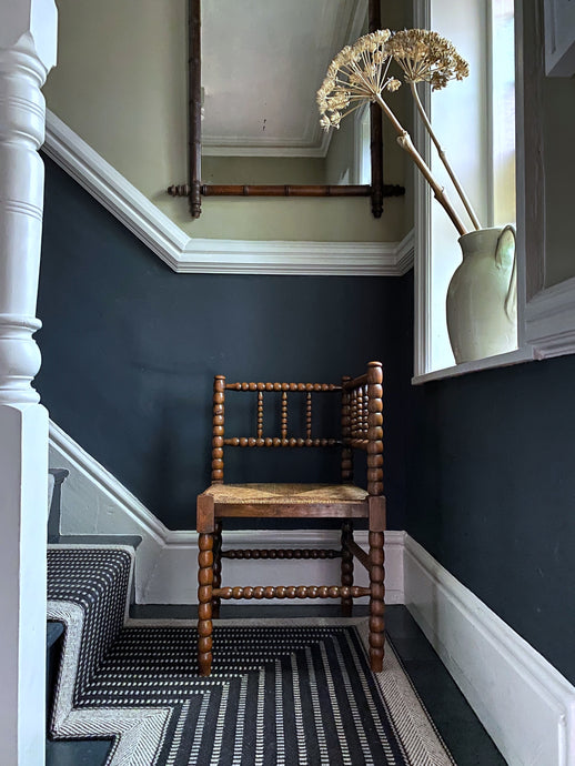 A Victorian wooden Bobbin turned chair with rush seat