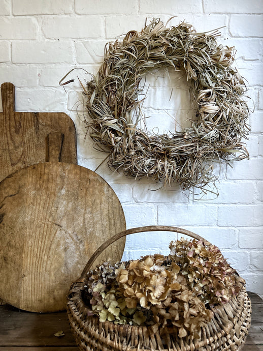 A large dried grass decorative wreath 50cm