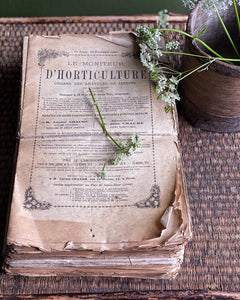 A bundle of string tied French Vintage Horticultural books