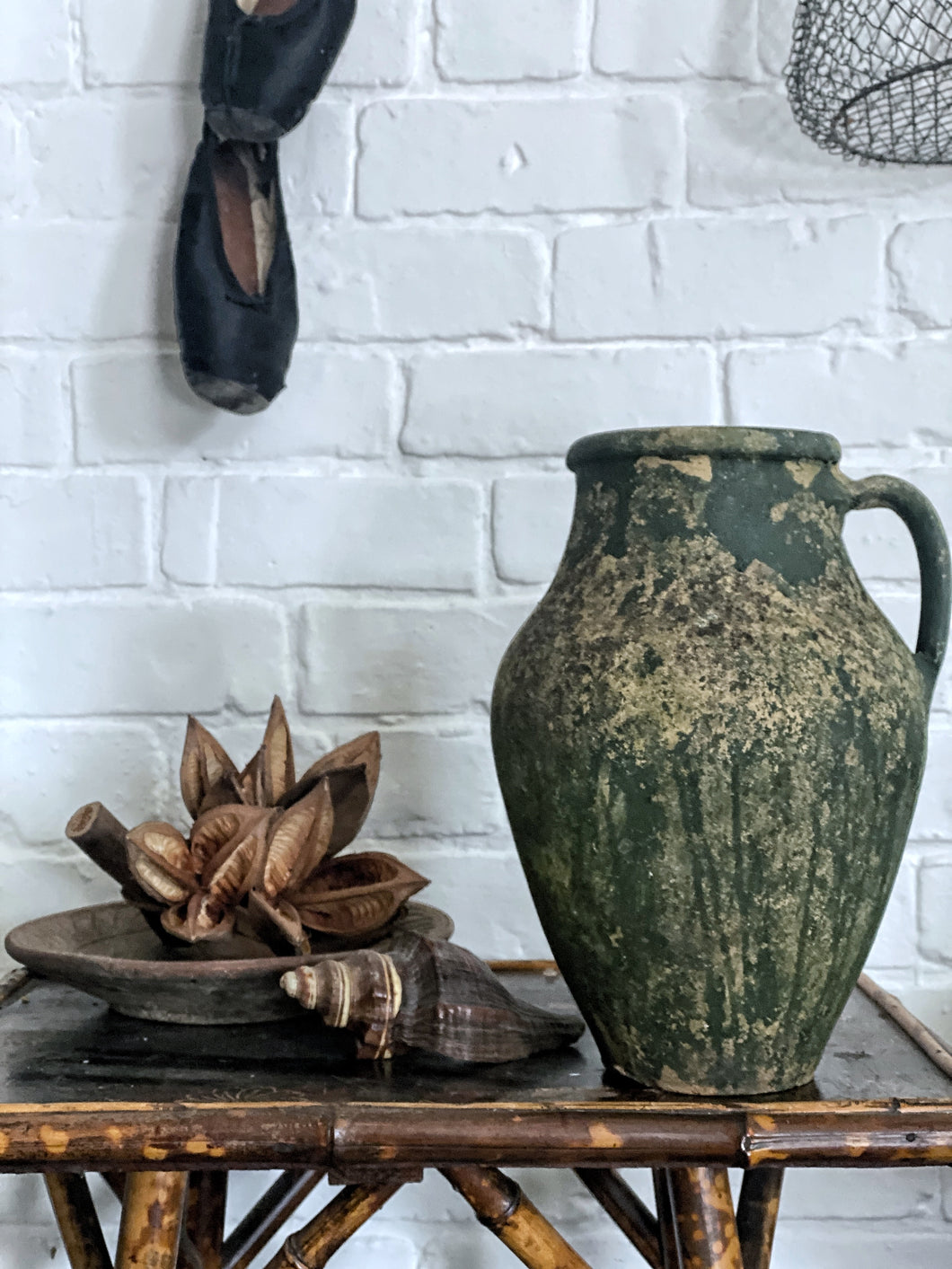 A French Rustic Vintage Green painted terracotta earthenware jug with handle