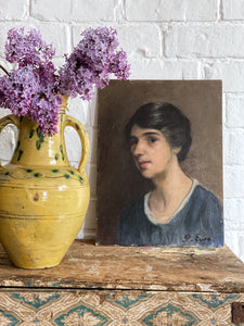 A portrait oil painting of a young lady on board signed G Eyre dated 1926