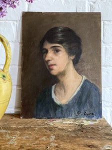 A portrait oil painting of a young lady on board signed G Eyre dated 1926