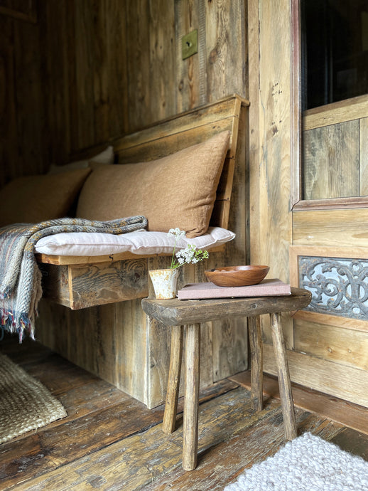 A Rustic Farmhouse style vintage wooden milking stool