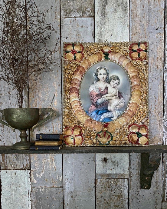 A Vintage grotto gypsy art religious print covered in shells