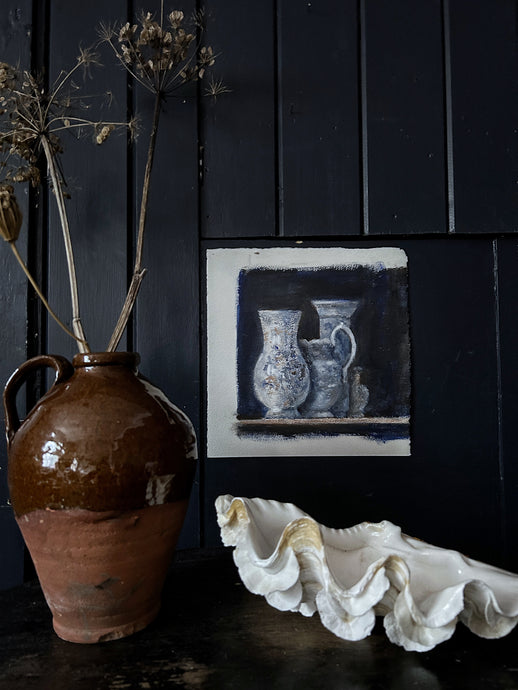 A still life study painting in gouache in deep inky blues