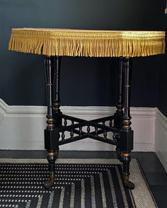 An antique black ebonised aesthetic movement Arts & Craft side table