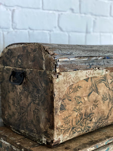 A beautiful vintage Decorative wooden trunk overlaid with layers of vintage wallpaper