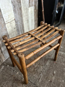 A vintage bamboo bench seat stool