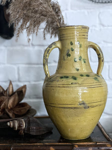 A vintage French yellow glazed and hand painted decorative jug